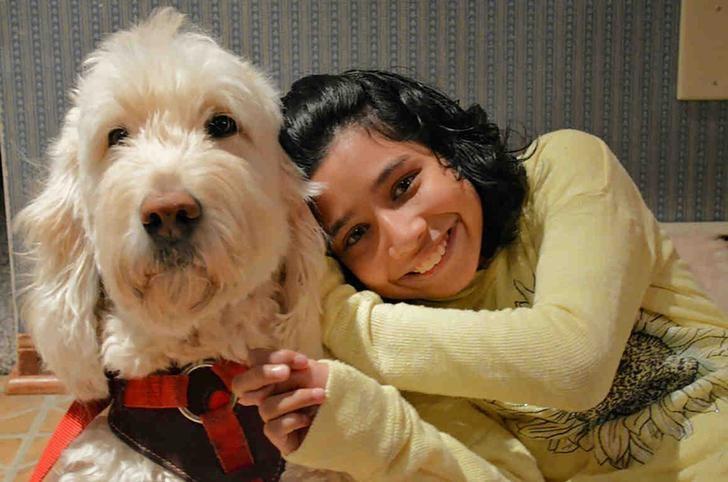 Ehlena Fry, 12, and her trained service dog, Wonder, are shown in this handout photo provided by the American Civil Liberties Union